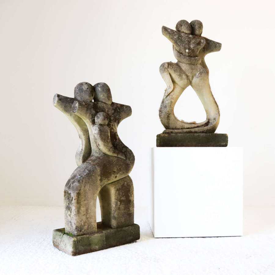 Pair mid century abstract cast stone figures