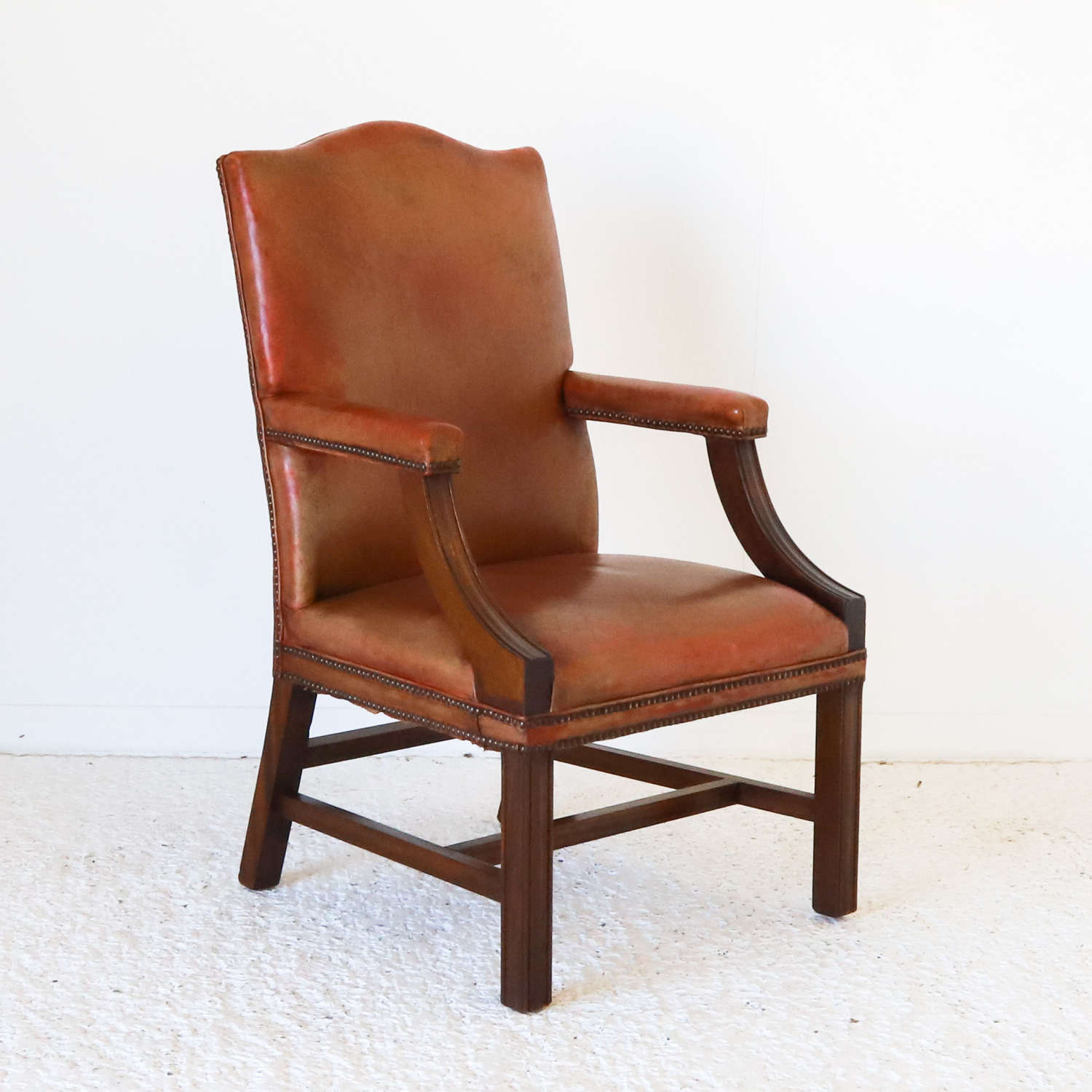 English 1940s mahogany Gainsborough library chair in old red leather