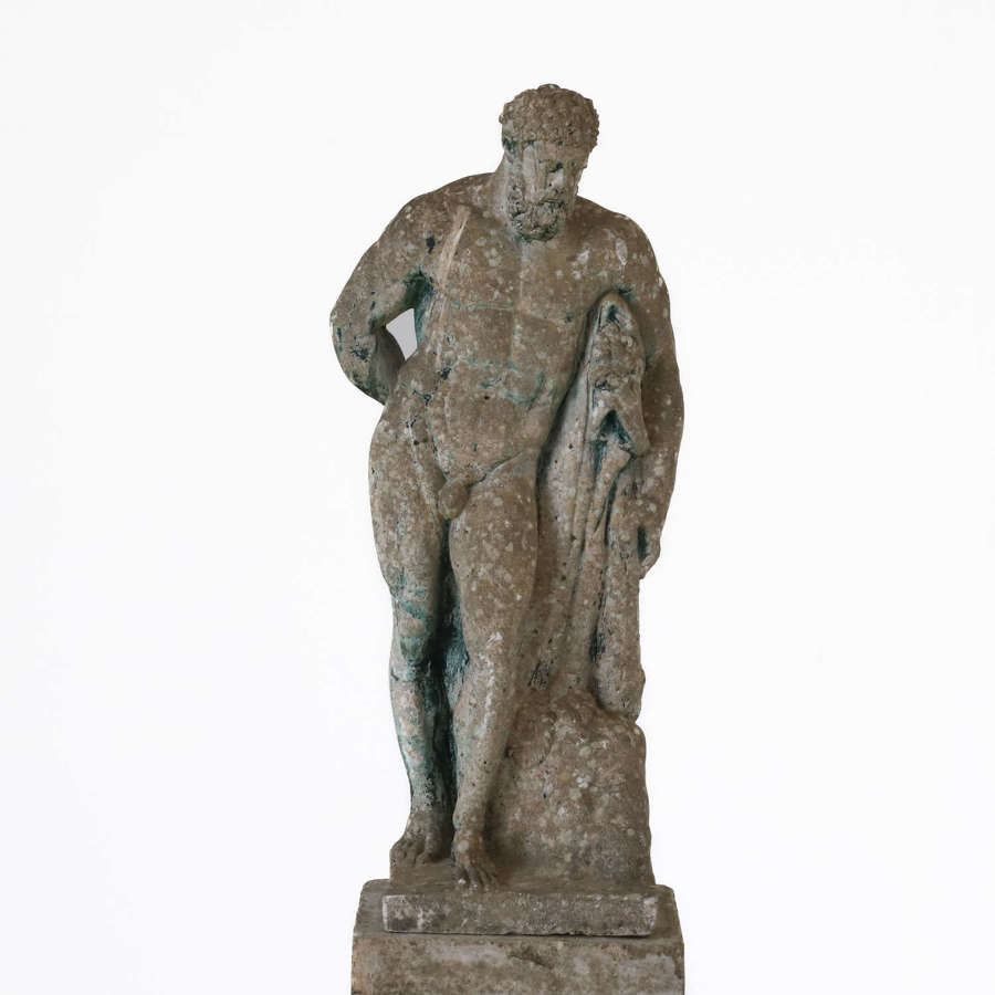 Vintage Heracles/Hercules statue on weathered pedestal