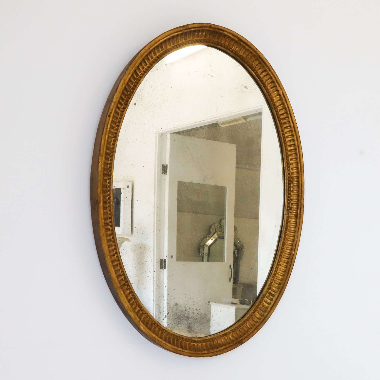 French 19th Century Foxed Oval Gilt Mirror